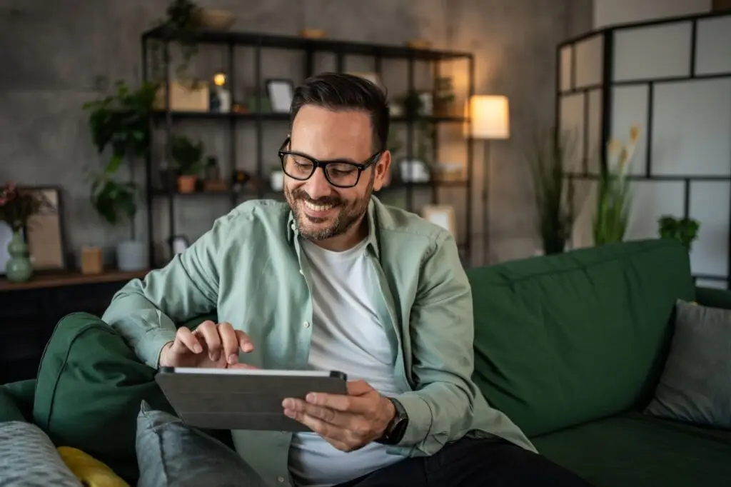 Homeowner comparing mortgage rate options on a tablet at home