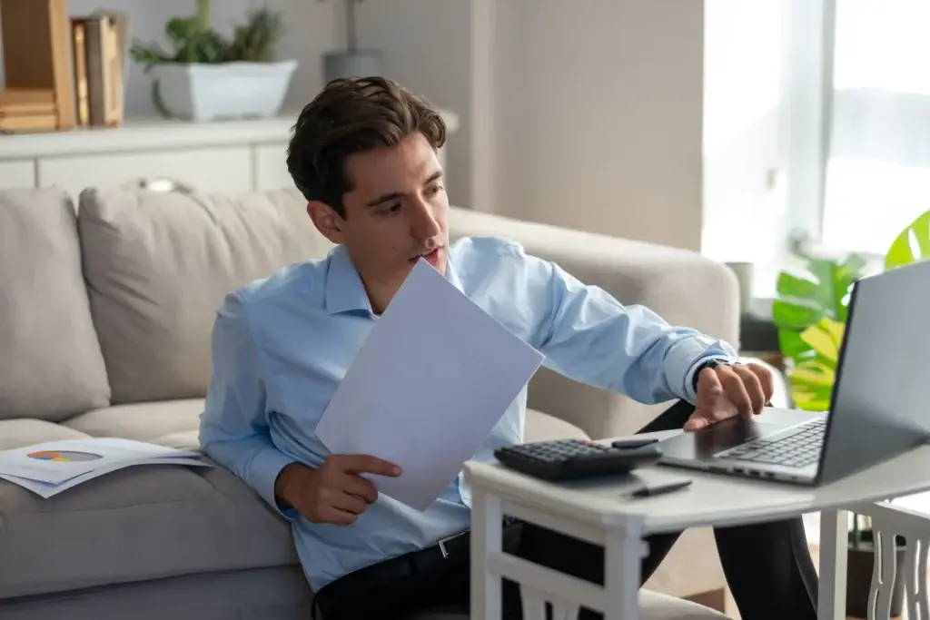 Homeowner reviewing a mortgage Loan Estimate and working out the break even point on points